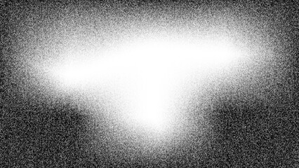Abstract black and white grainy background with light blurred gradient and copy space.