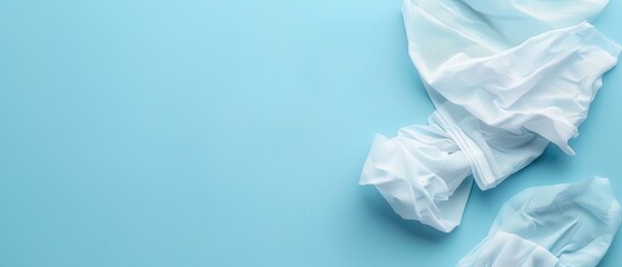 A blue background with a white lace item on it