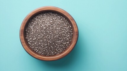 Chia seeds flour on brown wooden bowl and some seeds for baking, gluten free copy space