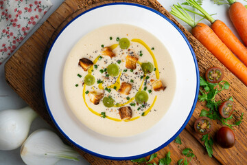 Spanish tapa cold soup of ajoblanco with grapes. Top view table with  decoration.