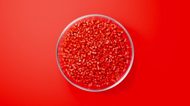 Rotating glass bowl with red plastic polypropylene granules, masterbatch polymer grain on black backdrop. HDPE or PVC resin pellets. 3d render animation