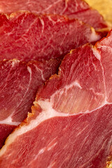 a piece of cured pork ham with thin layers of lard