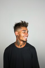 Fototapeta premium Tattooed man smiling confidently