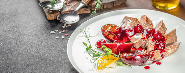 Baked duck fillet with plums. Food recipe background. Close up