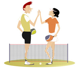 Man and woman play pickleball.
Pickleball court. Man and woman congratulate one another with a good shot

