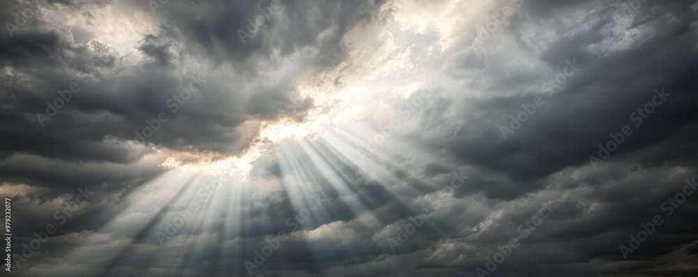 Poster dramatic sky with dark clouds and rays of light piercing through, creating a stunning atmospheric ef