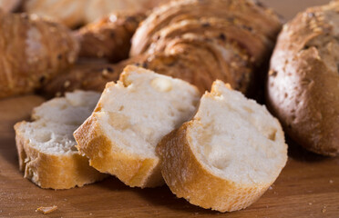 Slices of wheaten bread on wooden surface