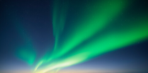 Blue dark sky with green polar lights and stars. Aurora borealis Northern lights in night winter sky