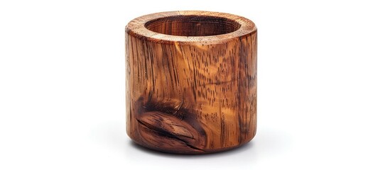 Obraz premium Handcrafted wooden barrel shaped container with intricate rustic carving texture and natural brown tones perfect for use as an artisanal home decor piece or accent in still life photography