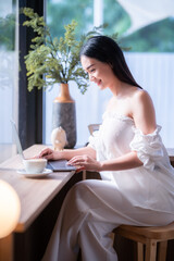 asian freelance people business female talking making using casual working with laptop computer for...