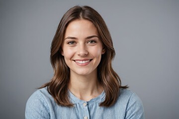 Fototapeta premium portrait of young smiling woman looking at camera with crossed arms