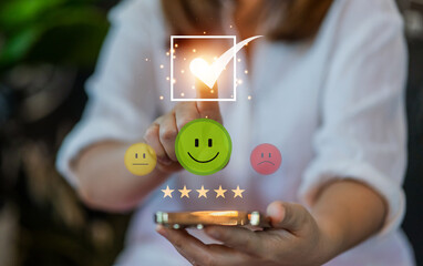 Customer satisfaction feedback with five star rating system, hand hold smartphone with digital...