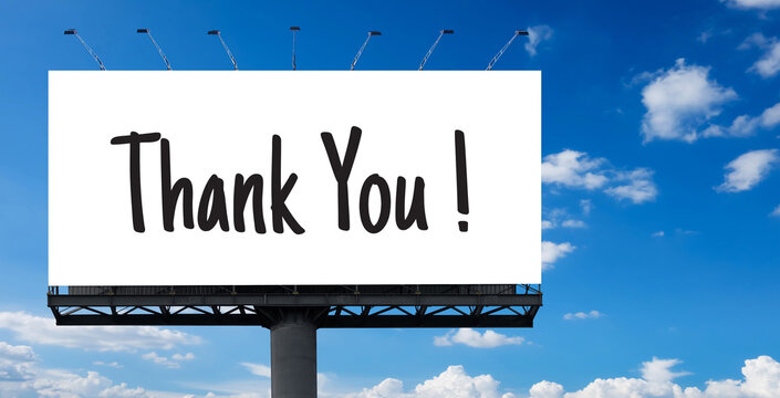 Billboard with the words "Thank You!" on blue sky with clouds in the background. Business concept.