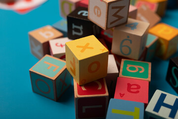 A colorful jumble of alphabet blocks spells out a message Learning is fun