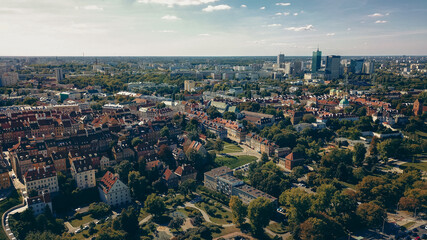 Aerial view of Warsaw showcasing historic buildings and modern architecture under a clear sky in daylight