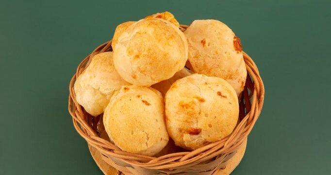 Minas Gerais cheese bread balls in a bowl and clean background front view
