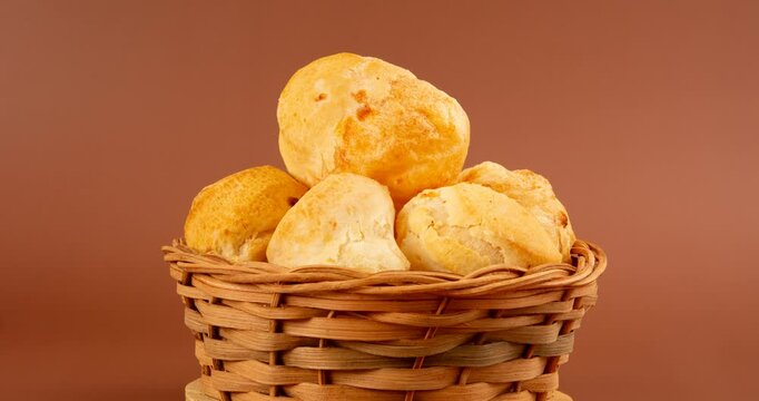 Minas Gerais cheese bread balls in a bowl and clean background front view
