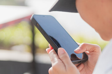Close-up of a Person Using a Smart phone Outdoors