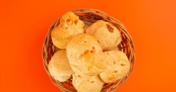 Minas Gerais cheese bread balls in a bowl and clean background front view
