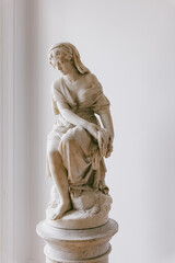 a marble stone statue of a Lady holding her dress, vintage art style with history, women under...