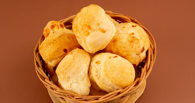 Minas Gerais cheese bread balls in a bowl and clean background front view

