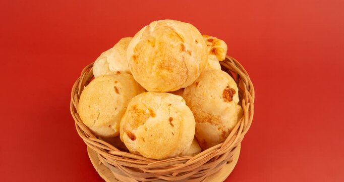 Minas Gerais cheese bread balls in a bowl and clean background front view
