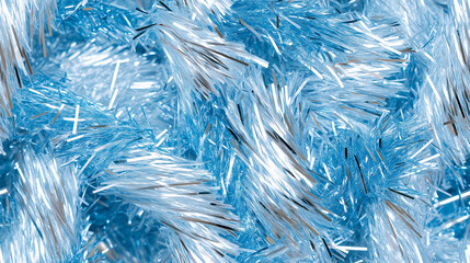 Fototapeta premium shimmering tinsel garland texture with a blend of pearly blue, silver and light blue strands