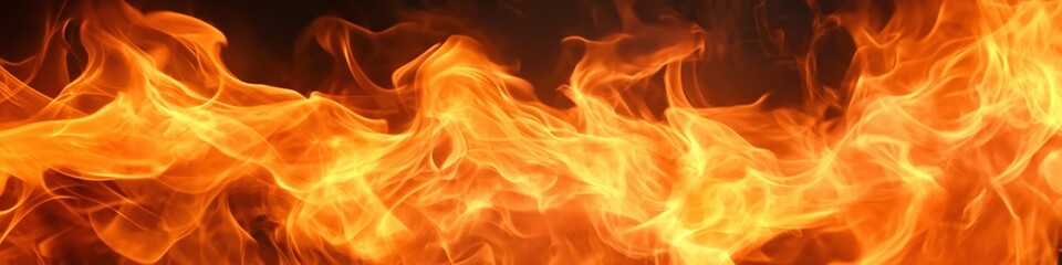 Fototapeta premium A close up of a flame with orange and yellow colors. The flame is very large and is almost as long as the image