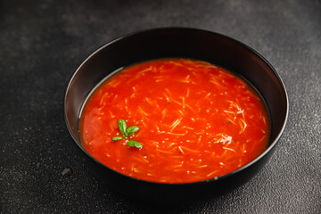 Tomato soup with vermicelli gazpacho first course dish fresh delicious gourmet food background on the table rustic food top view copy space keto and paleo diet Vegetarian and vegan food