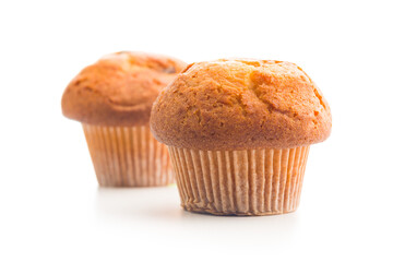 Sweet muffin cakes isolated on white background.