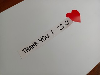 Thank You text word on the sticky notes paper isolated on white. Gratitude concept. 