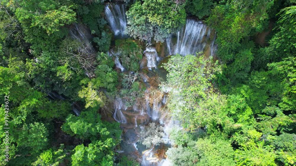 Sticker View of Kuang Si Waterfall in a lush forest with beautiful nature in the rainy season in Luang Prabang, Laos, Asia