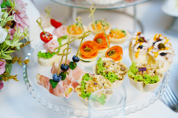 A plate of canapes on a served festive table. catering for a holiday.