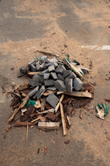 construction derbish like grey slabs, sand and wooden planks