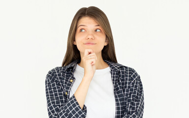 Cute woman thinking about smth. Young brunette student girl is thoughtful on white background