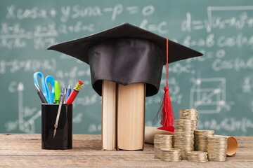 Student Success and education investment concept, coins and books