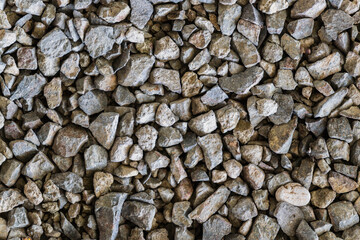 pile of gravel stones at construction site, background and texture