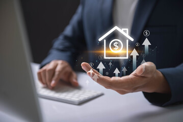 Real Estate Value Increase concept. Businessman holding a virtual house icon with dollar signs and upward arrows, symbolizing increasing property value and real estate investments.