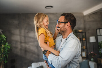 adult single father hold daughter and have fun with her