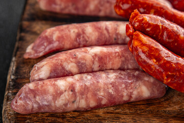 sausages meat raw beef, pork, chicken, lamb dish fresh delicious gourmet food background on the table rustic food top view copy space