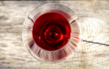 Glass of red wine on wooden bar
