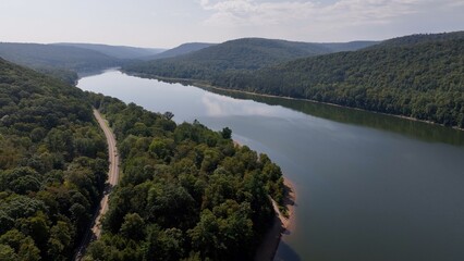 Beautiful day in mountains in nature with sunshine peaceful calm water with cloud reflections...