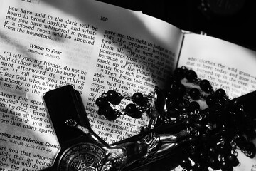Bible text page close up with objects black and white