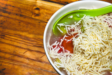 sweet ice with sprinkles of cheese on top. This ice is usually called mixed ice or es teler. It has a sweet taste and is perfect for dessert.