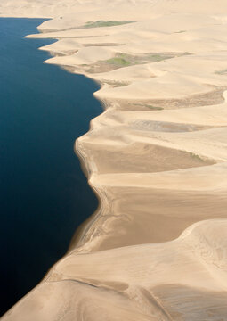 Aerial view of Namib Desert and Atlantic Ocean south of Walvis Bay. Aerial view. Namib-Naukluft Park, Namibia.