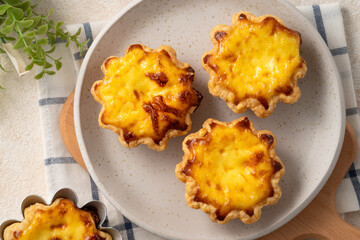 Delicious puff pastry Portuguese egg tart Pastel de nata in flower shape.