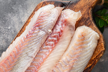 fillet raw white fish cod or halibut fresh meal food snack on the table copy space food background...