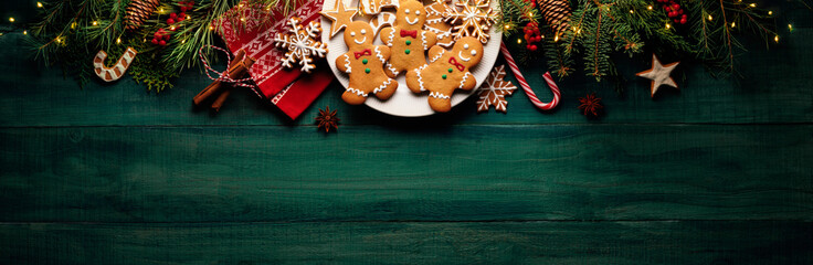 Christmas gingerbread cookies on winter holidays background