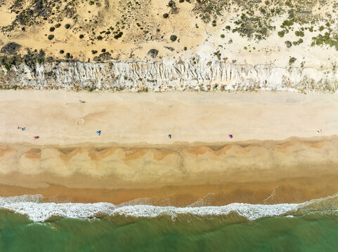 Aerial view of Beach life at the Asperillo cliff, the highest dune cliff in Europe. Do&ntilde;ana Natural Park, Huelva province, Andalusia, Spain.