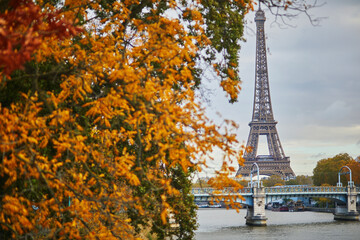 Scenic view to the Eiffel tower over the river Seine on a nice autumn day in Paris.